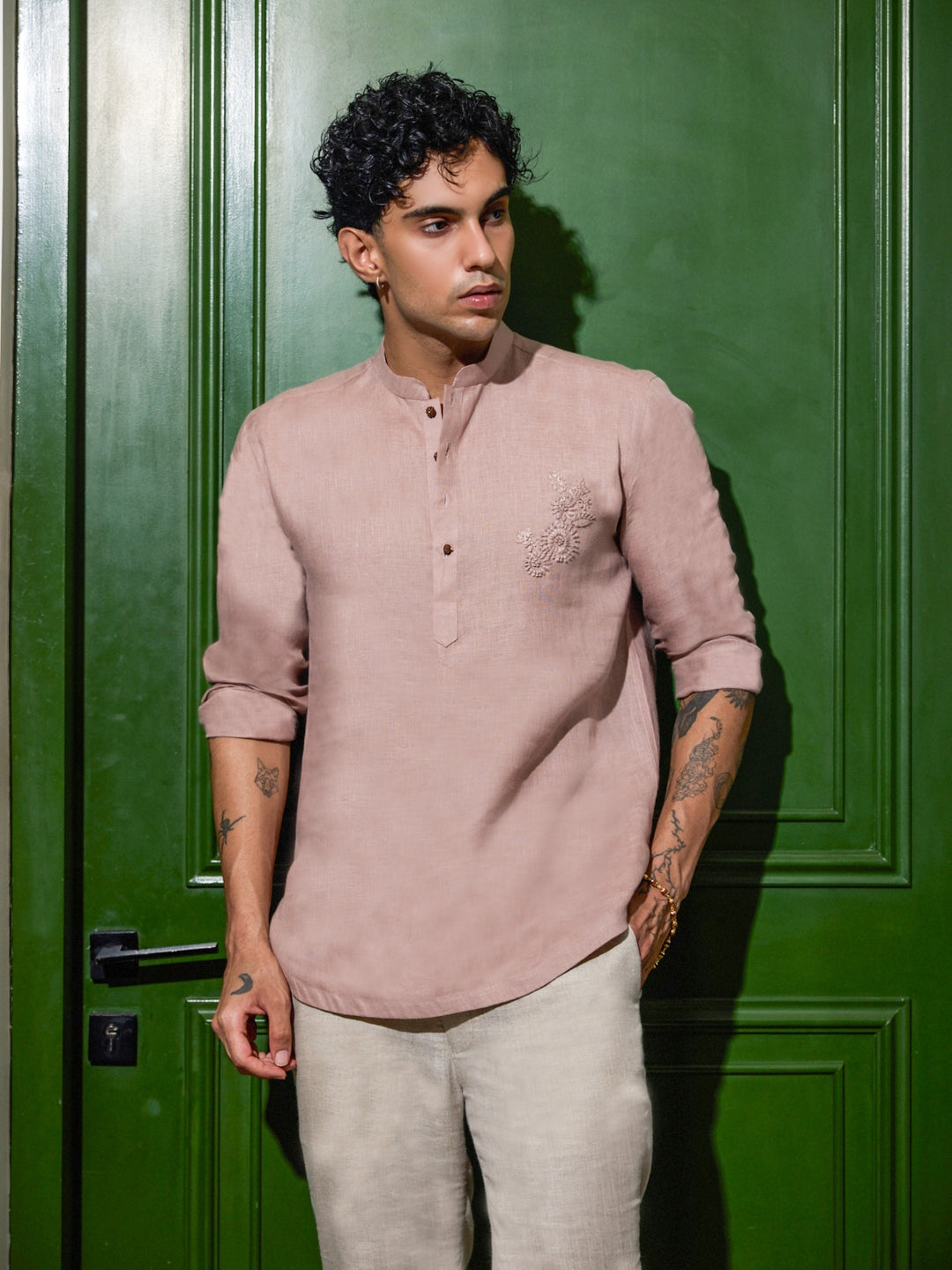 Man wearing purple hand embroidered linen short kurta with mandarin collar and full sleeves